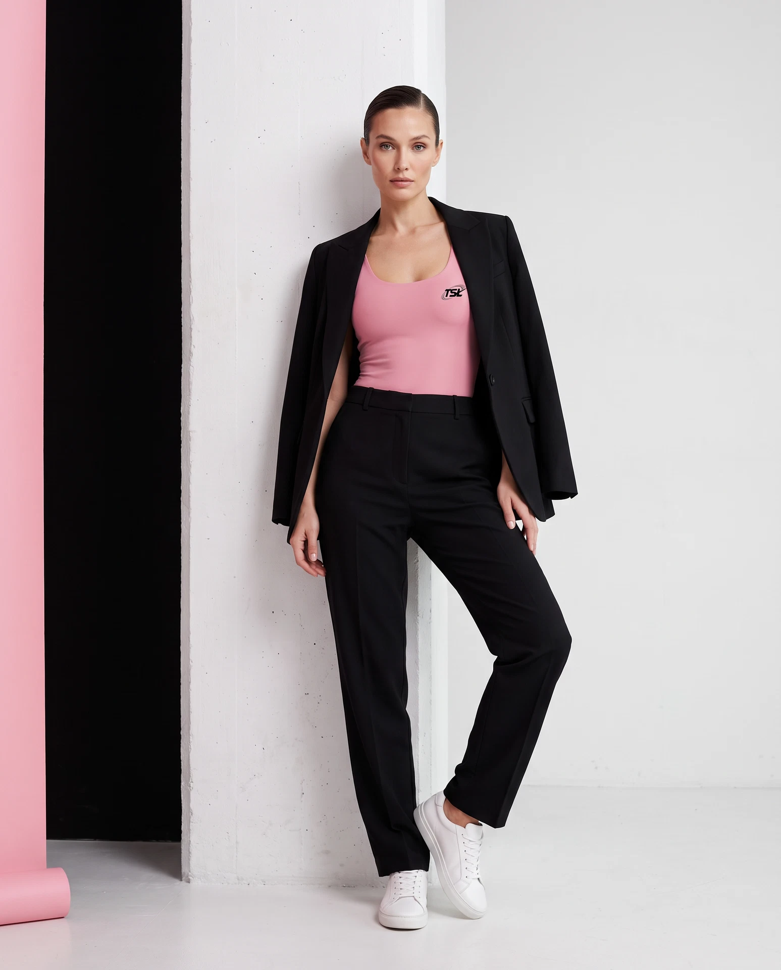 TheSweetLie pink bodysuit with black TSL mark