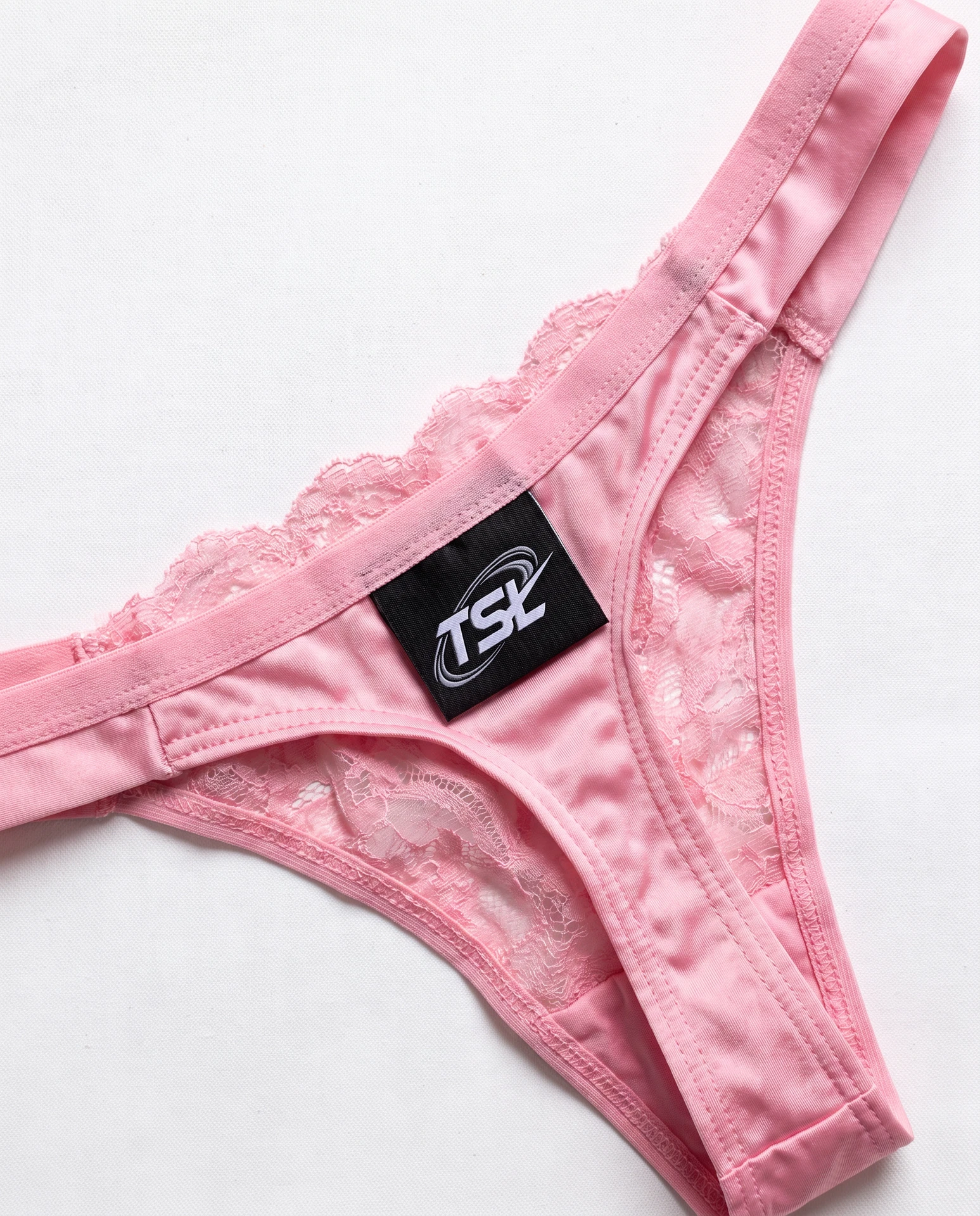 TheSweetLie pink thong with black TSL label