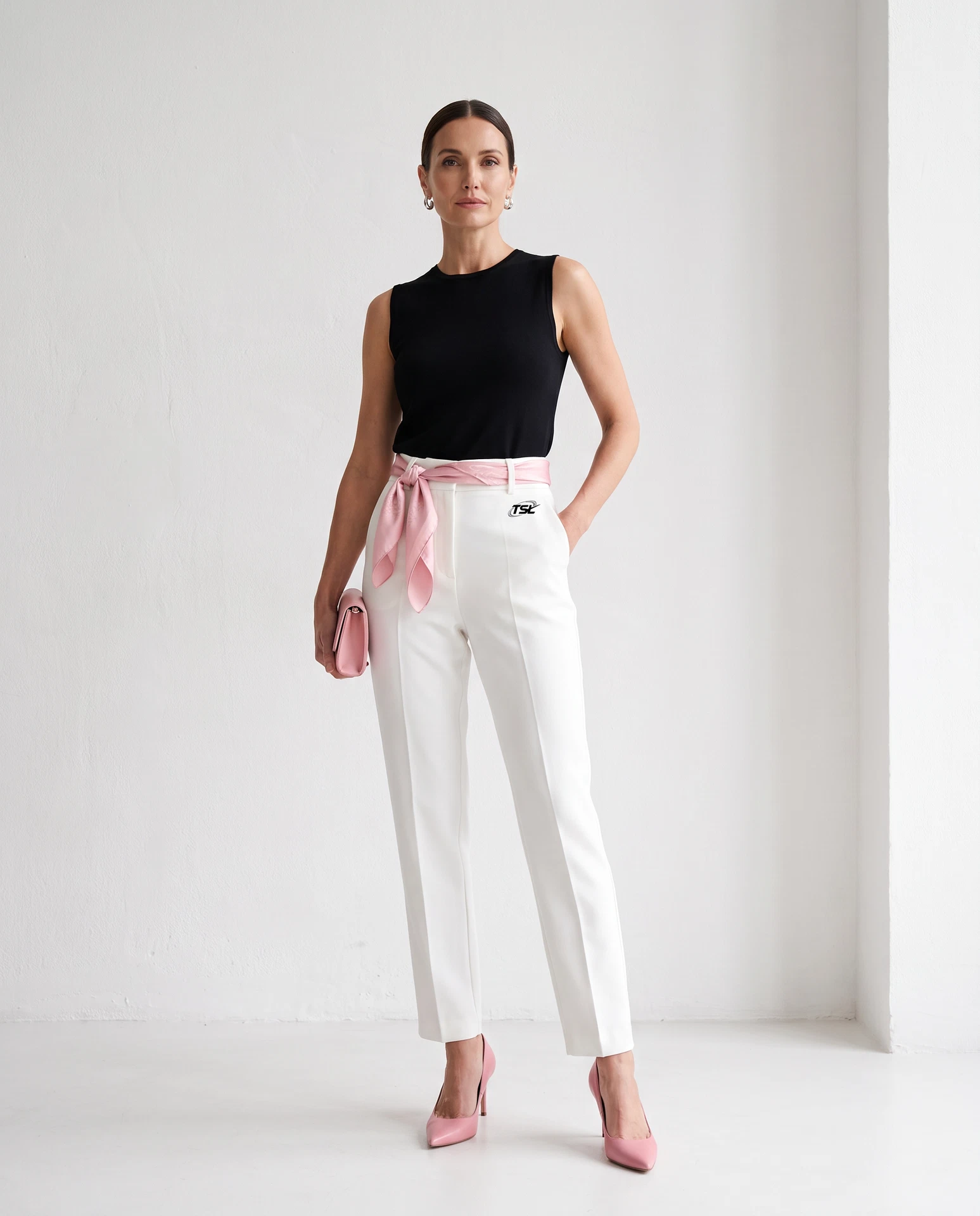 TheSweetLie white trousers with black TSL logo